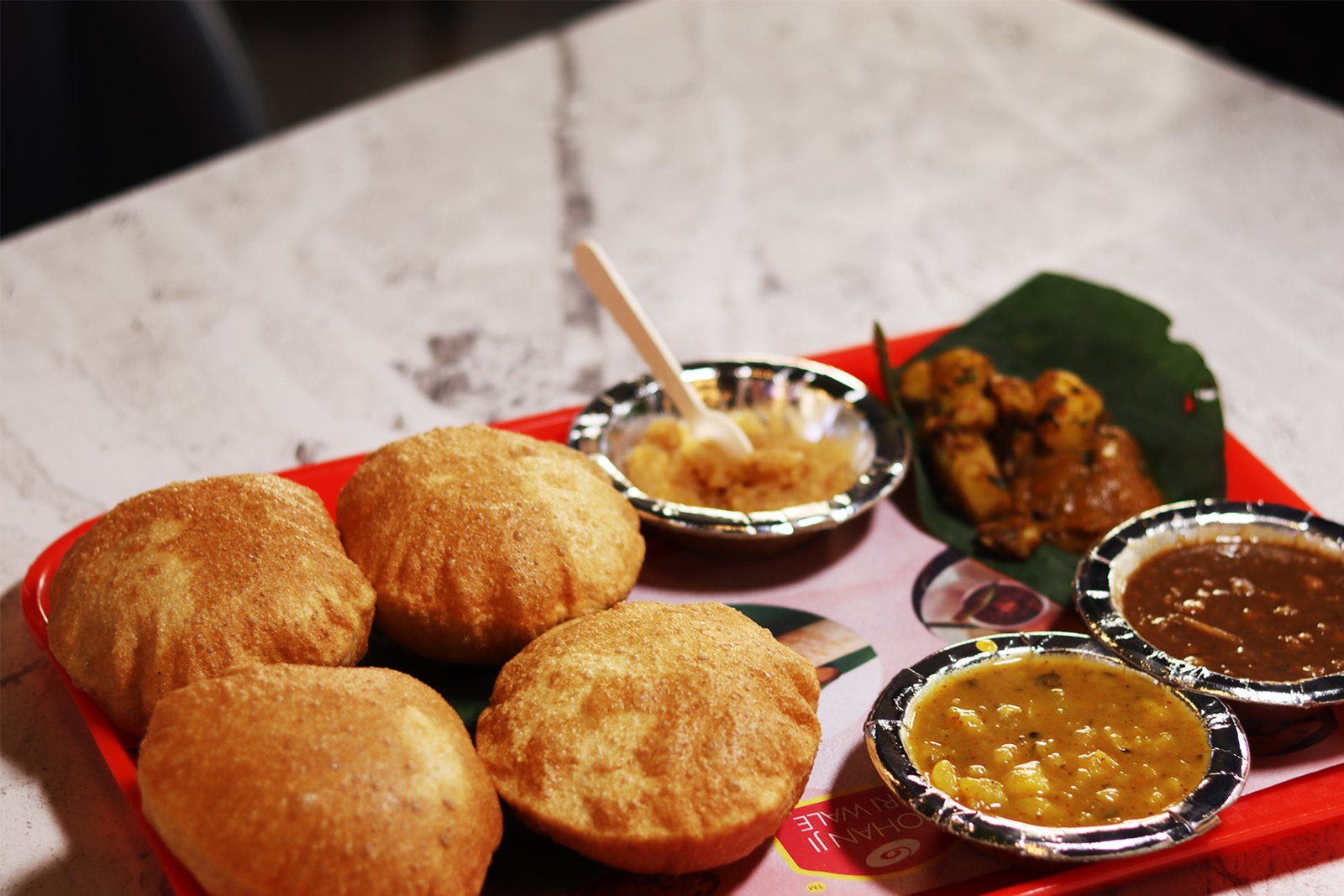Authentic Mohan Ji Poori Wale Breakfast Platter with Bedmi Poori, Aloo Sabzi, Chana & Kesar Halwa